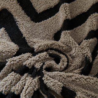 Housse de canapé en peluche à motif géométrique