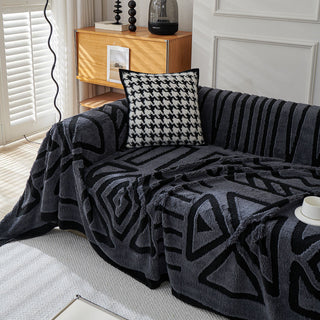 Housse de canapé en peluche à motif géométrique