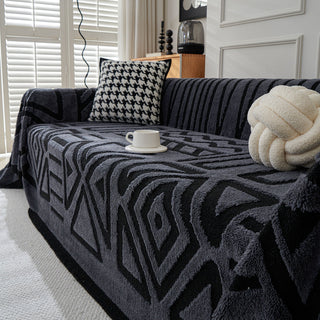 Housse de canapé en peluche à motif géométrique