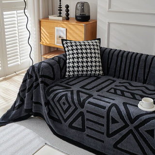 Housse de canapé en peluche à motif géométrique