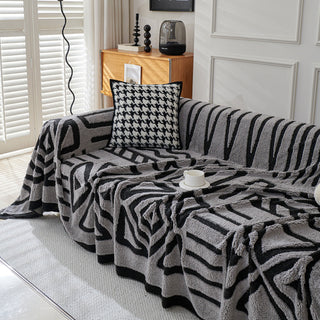 Housse de canapé en peluche à motif géométrique