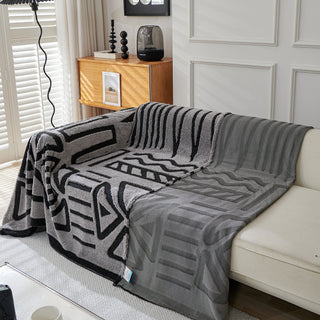 Housse de canapé en peluche à motif géométrique