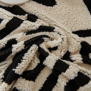 Housse de canapé en peluche à motif géométrique