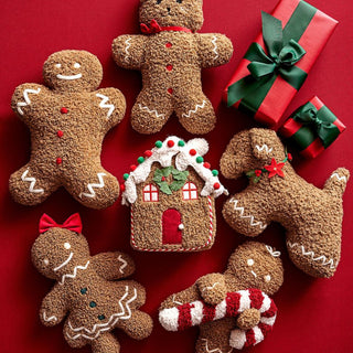 Coussin de maison douillet en pain d'épice avec pompon en bonbon de canne à sucre et décorations de Noël