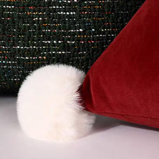 Coussin triangulaire avec chapeau de Noël
