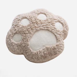Coussin réconfortant à motif de pattes de chien dans des tons neutres, design doux et ludique