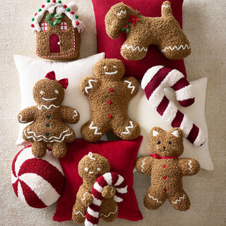 Coussin de maison douillet en pain d'épice avec pompon en bonbon de canne à sucre et décorations de Noël